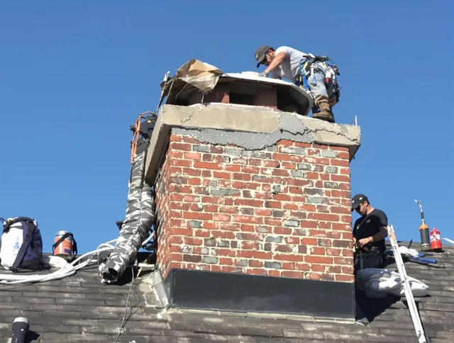 Wethersfield Chimney Sweep installing a custom chimney crown in Wethersfield, CT