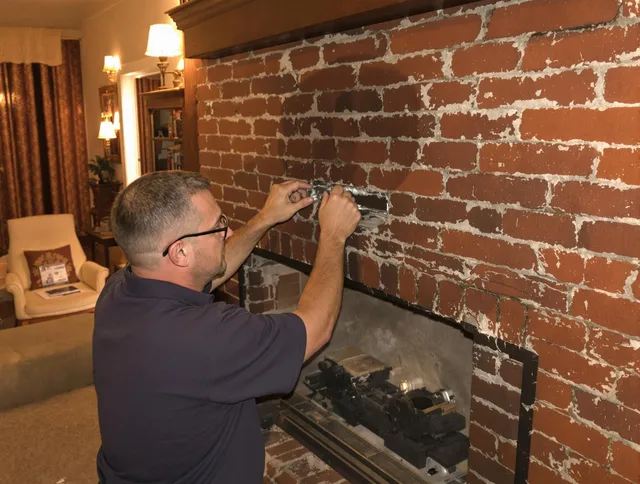 Wethersfield Chimney Sweep expert fixing a fireplace in Wethersfield, CT